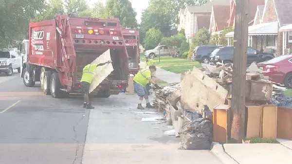 125 trash trucks sweep through Dearborn's neighborhoods, remove flood damaged items
