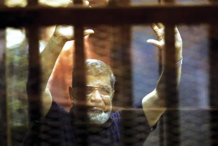 Mohamed Morsi died in court, in a soundproof cage under guards' watch
