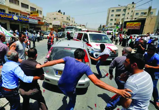 Palestinian killed as settler opens fire during clashes