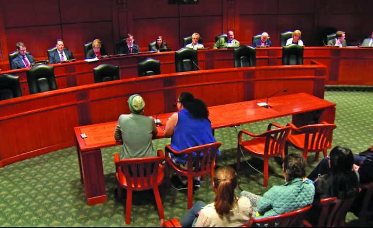 Activists, officials slam State House committee for passing anti-sanctuary bills