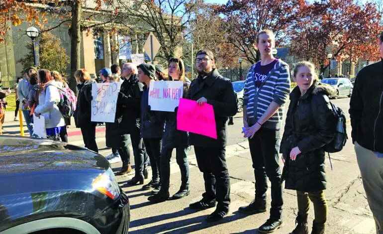 University of Michigan students walk out of class, protesting speech by White nationalist