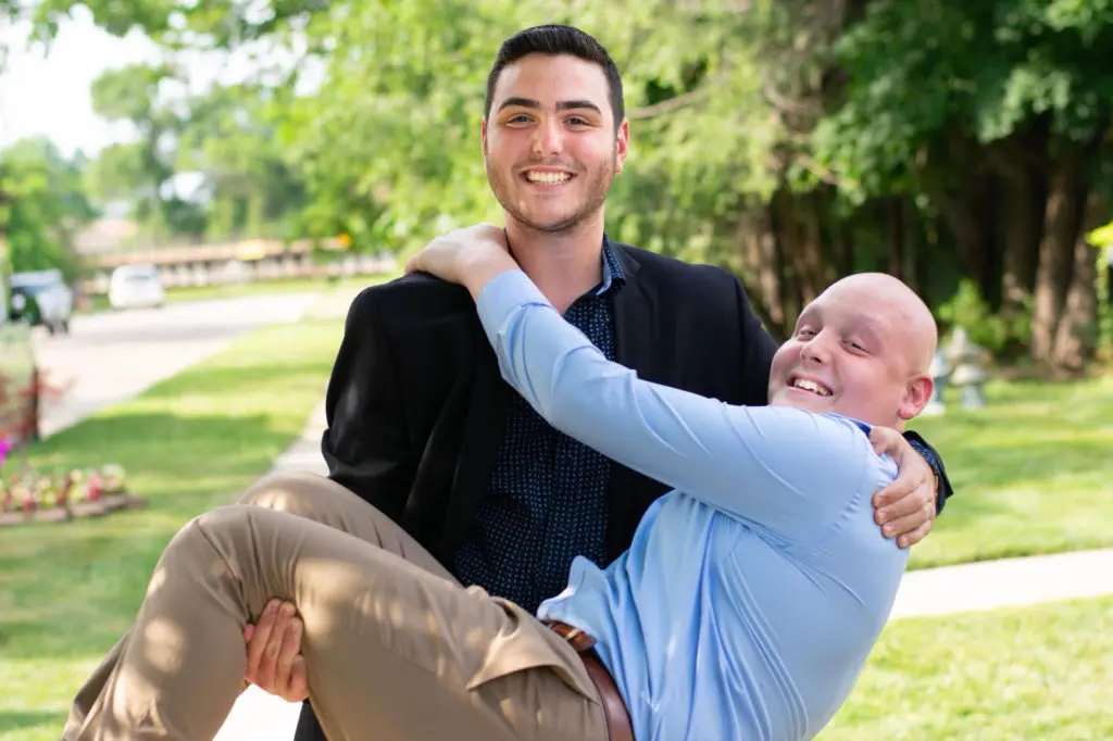 Ali carrying his twin brother Mohamad Osman