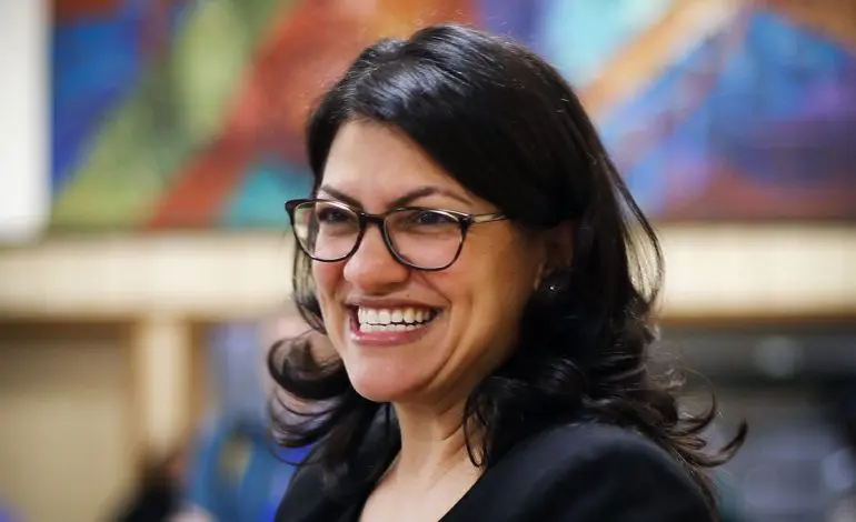 Rashida Tlaib reacts to the COVID relief bill