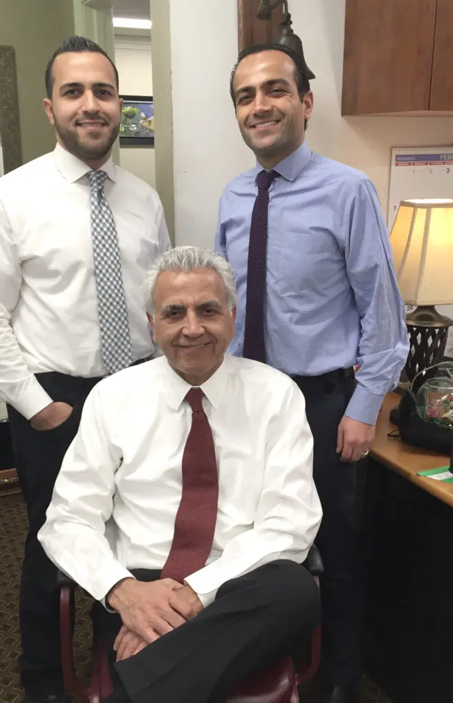 Jacob Bacall and behind him his two sons Joseph and Michael