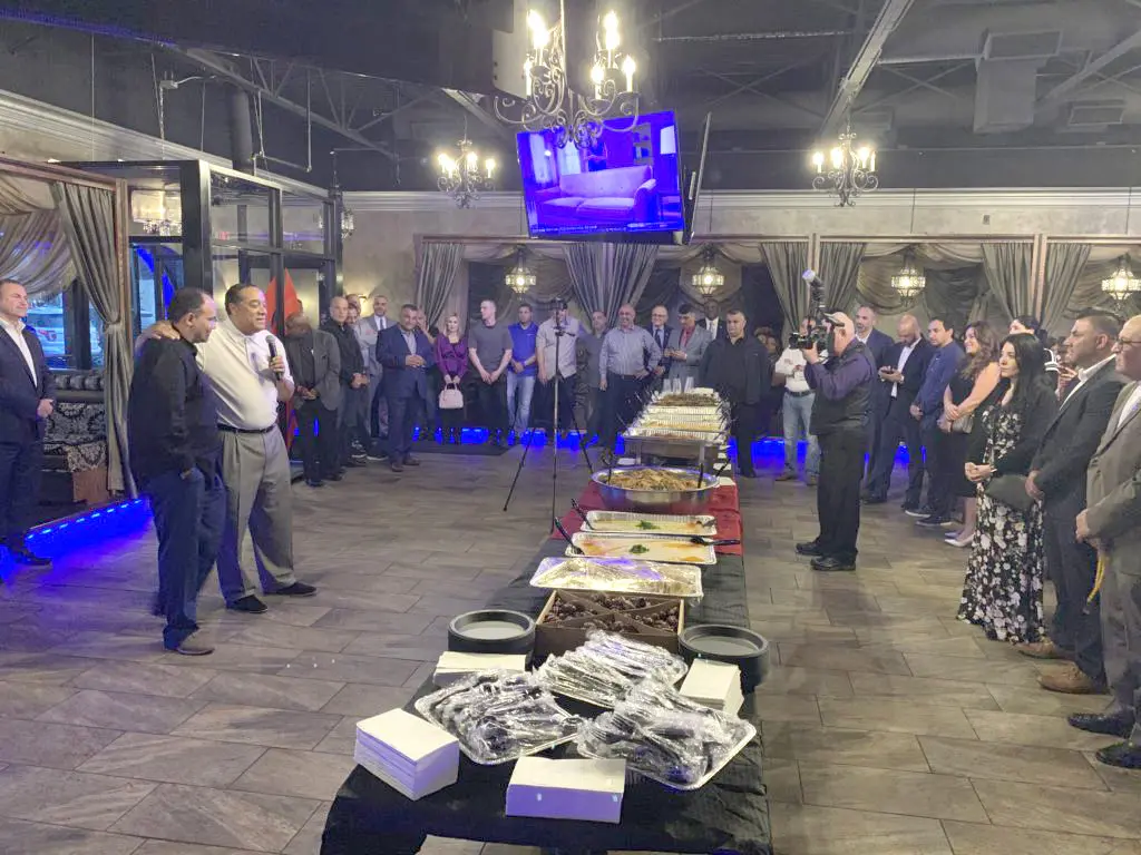 Wayne County Sheriff Benny Napoleon spaeking and next to him is his Chief of Operation Mike Jaafar at the annual iftar dinner that the Sheriff hosted on Thursday at Lava Lounge Too in Dearborn Heights on May 16. - Photo The Arab American news