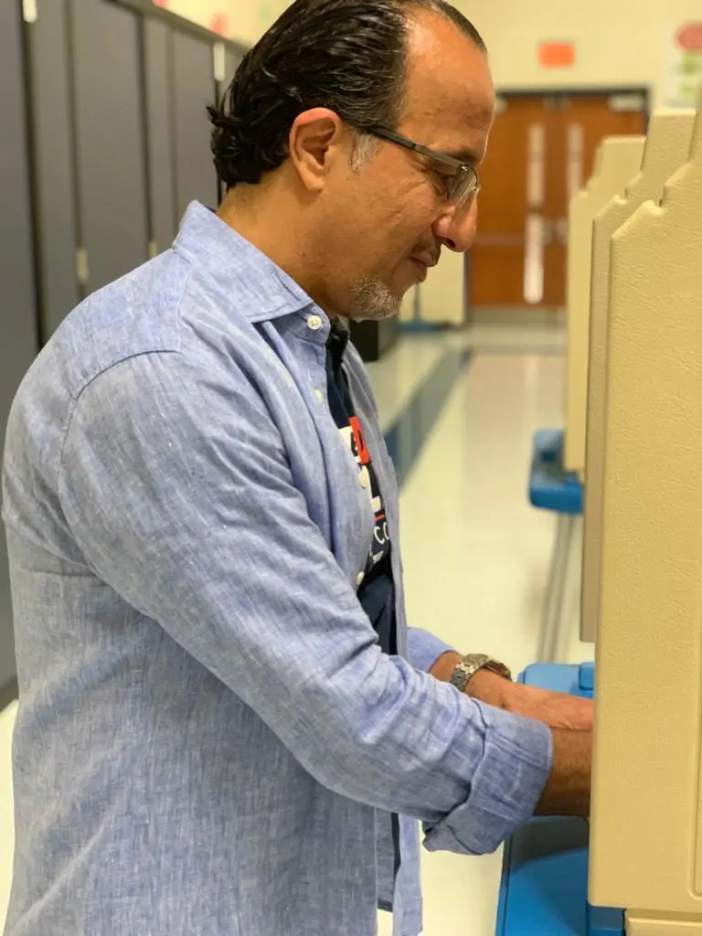 Dave Abdallah casting his vote at Kinloch Elementary