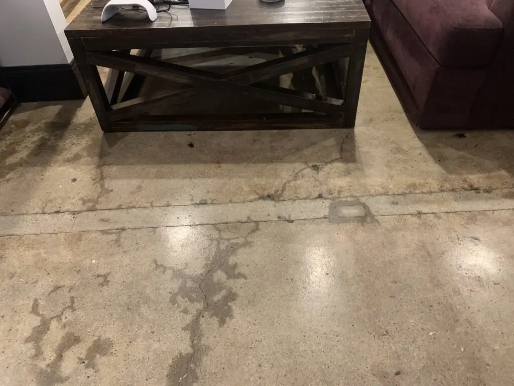 Water around cracks in the flooring in Ramsey Turkmani's apartment