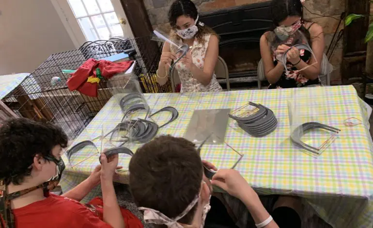 Church group members come together with Muslim neighbor in Dearborn to provide face shields for healthcare workers