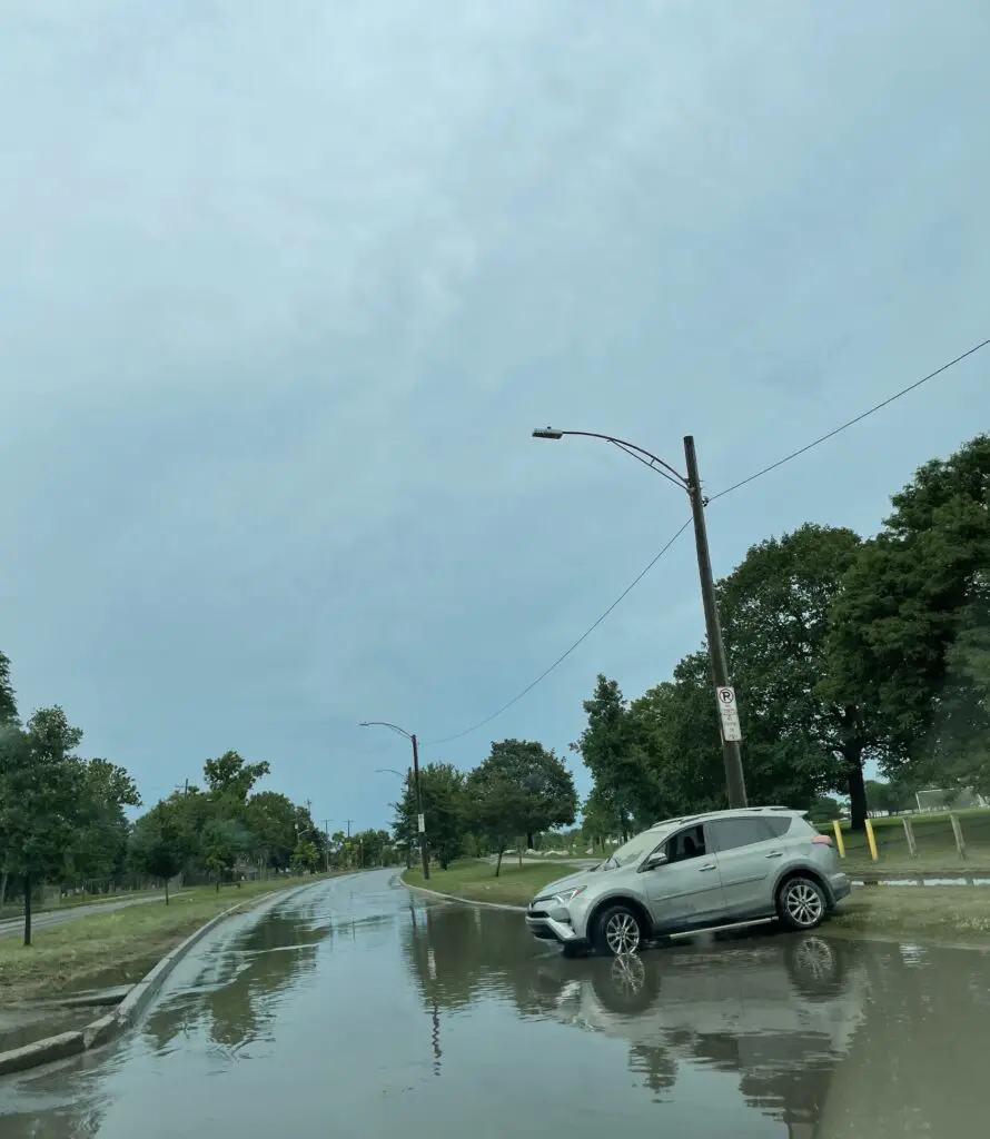 A car sits abandoned after it was caught in intense flooding in Dearborn's Southend