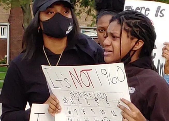 Parents hold protest against racism outside of D7 Board of Education building in Dearborn Heights 