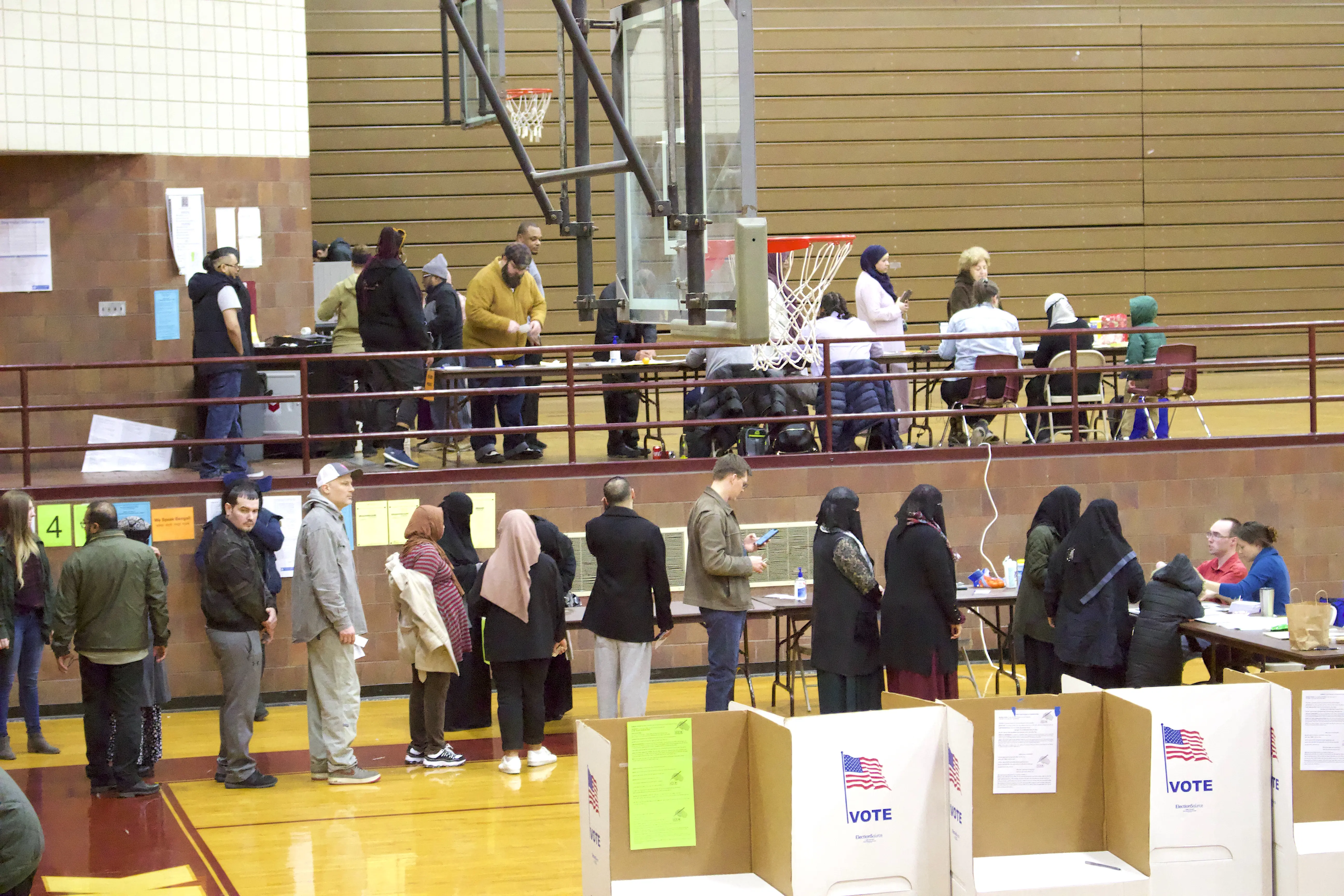 Voters line up at a precinct in Hamtramck in March, 2020. The diverse city has a significant Arab population, and voters have consistently come out for Sanders backed Arab candidates. Photo: Hassan Abbas/The Arab American News