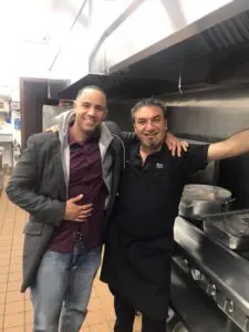 Josh with his cousin Joe Bazzi inside the kitchen at Byblos Banquet Center in Dearborn