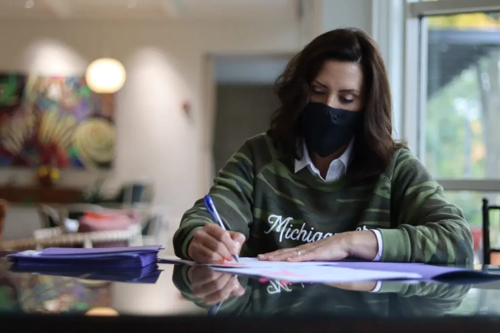 Whitmer signs several bills, including some that contain COVID-19 related protections for workers and businesses, Thursday, Oct. 22.