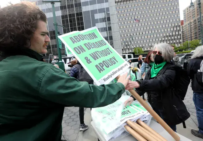 Signs are handed out before a pro-abortion rights rally in Foley Square in lower Manhattan May 3. Photo: Seth Harrison/The Journal News