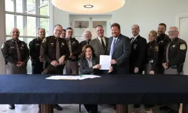 Whitmer signs bills to put more officers on the road