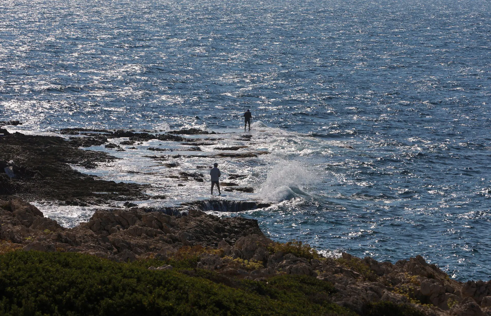 Fishermen catch fish, in Naqoura, near the Lebanese-Israeli border, southern Lebanon, Oct. 11. Photo: Aziz Taher/Reuters