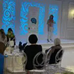 Dr Kristine Ajrouch leads the Town hall in Dearborn.