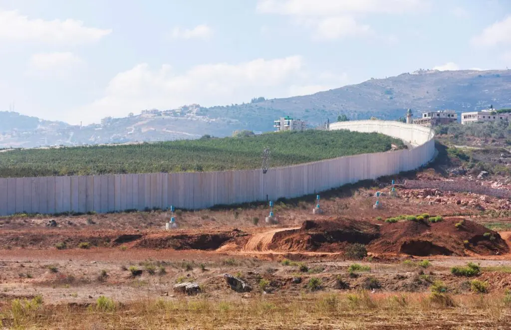 U.N. "blue line" notifications are pictured near the Lebanese-Israeli border as seen from the southern Lebanese village of Kfar Kila, Lebanon October 14, 2022. REUTERS