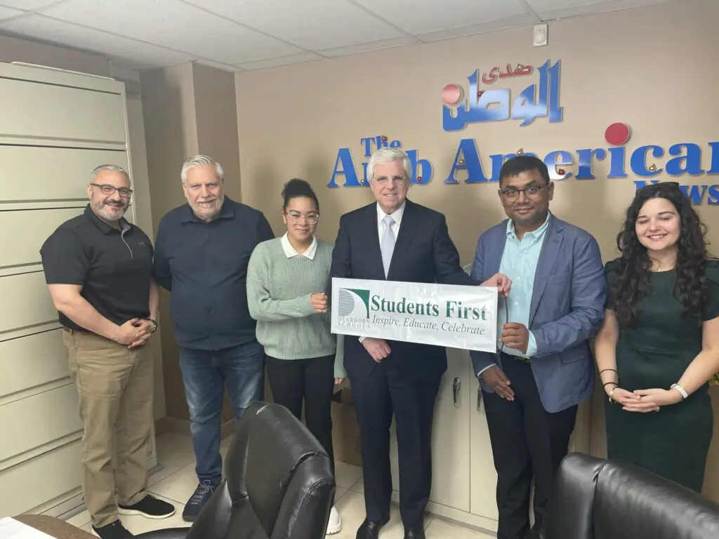 Ariel Corley, a senior at Edsel Ford High School in Dearborn (second from left) and a schoarship awardee this year surronded by F.L.I.P. interviewers at The Arab American News offices. – Photo courtesy of Dr. Glenn Melayko
