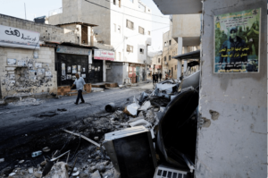 Palestinians walk on the street after the Israeli army's withdrawal from the Jenin camp, in Jenin, in the Israeli-occupied West Bank July 5, 2023. – Photo by Reuters