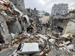 Palestinians inspect the site of Israeli strikes on houses, amid the ongoing conflict between Israel and the Palestinian Islamist group Hamas, in Rafah, in the southern Gaza Strip December 13. - Photo by Reuters