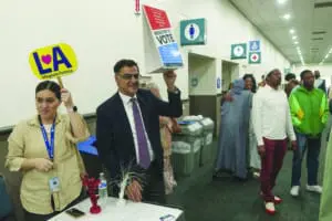 Muslim Public Affairs Council President and co-founder Salam Al-Marayati, second from left, invites American Muslim citizens to register to vote after thousands gathered to mark the end of the holy month of Ramadan in Los Angeles, Wednesday, April 10. – Photo by AP/ Damian Dovarganes