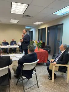 Massad Boulos speaking in front of a group of Arab and Muslim activists in Troy two weeks ago. On his right is Dr. Yahya Basha. Seated on his left is Dr. Bishara Bahbah, national chairman of Arab Americans for Trump.