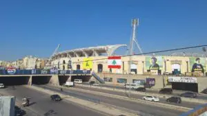 The Beirut Sports City Stadium is adorned with posters of Sayyed Hassan Nasrallah and Sayyed Hashem Safieddine ahead of their funerals at the arena. – Photo by the L'Orient Today