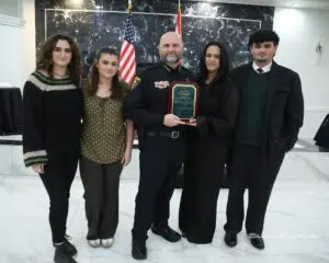 Dearborn Police Chief Issa Shahin surrounded by his wife and their three children during the event. – Photo by Abbas Shehab