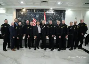 Dearborn Police Chief Issa Shahin surrounded by Dearborn police officers who attended the event. - By Shehab Pro-Media