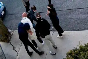 In this image taken from security camera video, Rumeysa Ozturk, a 30-year-old doctoral student at Tufts University, is detained by Department of Homeland Security agents on a street in Sommerville, Mass., March 25. – Photo by AP