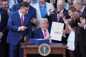 Trump signs his signature bill of tax breaks and spending cuts at the White House, Friday, July 4, in Washington, D.C. – Videograb