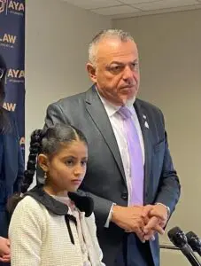Saida Mashrah stands next to her attorney and ACRL founder Nabih Ayad during Wednesday's press conference