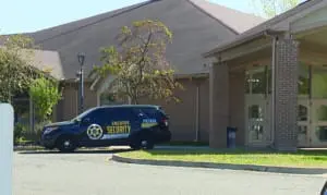 A security vehicle parked in front of the Islamic Institute of America in Dearborn Heights.