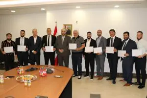 Medical mission team members receive certificates of appreciation from the Lebanese Minister of Public Health at the end of the mission.
