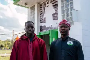 MhamadouDiop and Serigne Lo (different Serigne Lo that quoted above) outside of the Khadimu Rassul Foundation. The picture they are standing under is Ahmadou Bamba, the founder of Mouridism