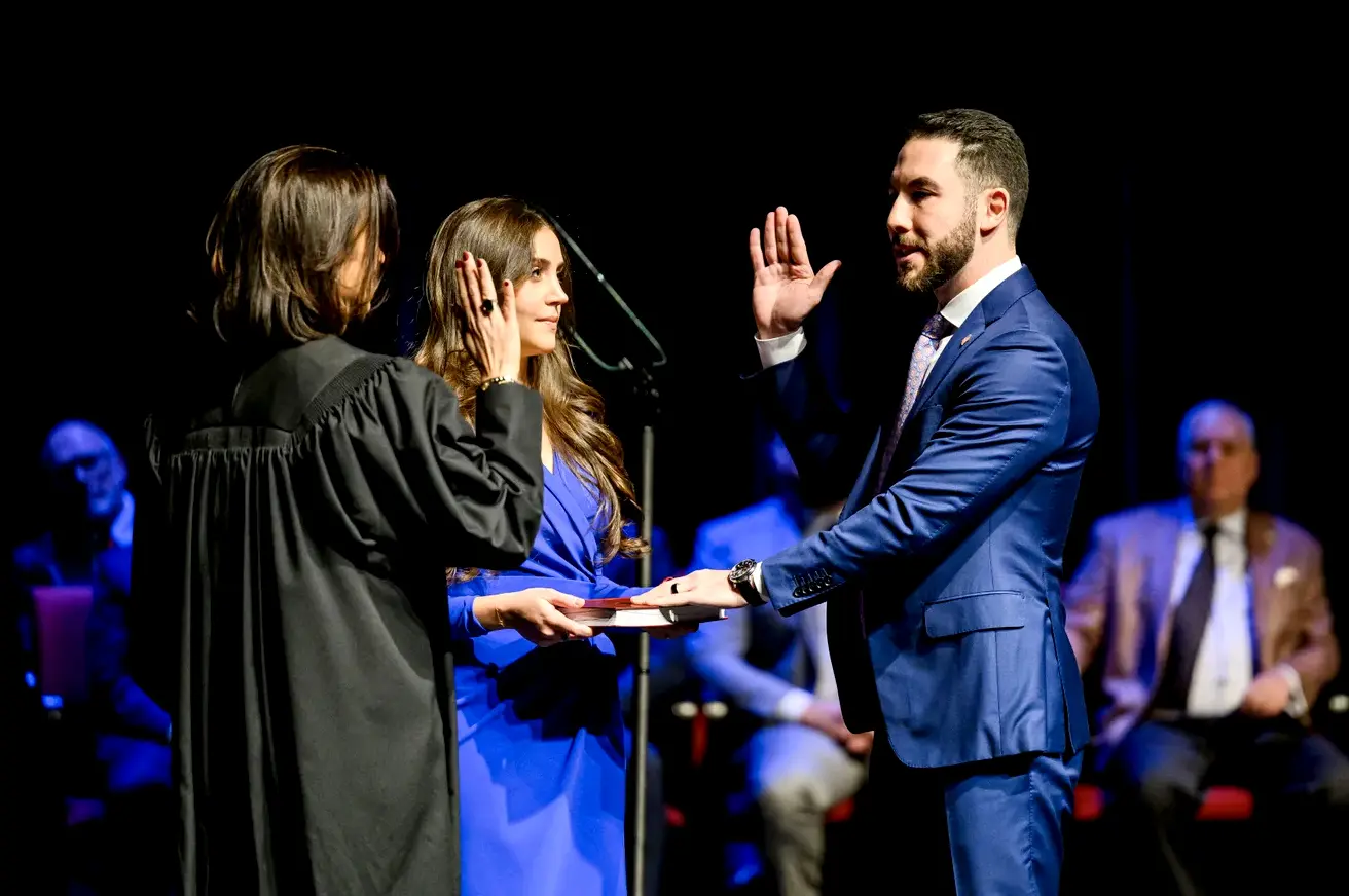 Hammoud takes the oath of office on a family copy of the Holy Quran before Michigan Court of Appeals Judge Mariam Saad Bazzi, with his wife, Fatima Baydoun, by his side during last Saturday’s inauguration ceremony.