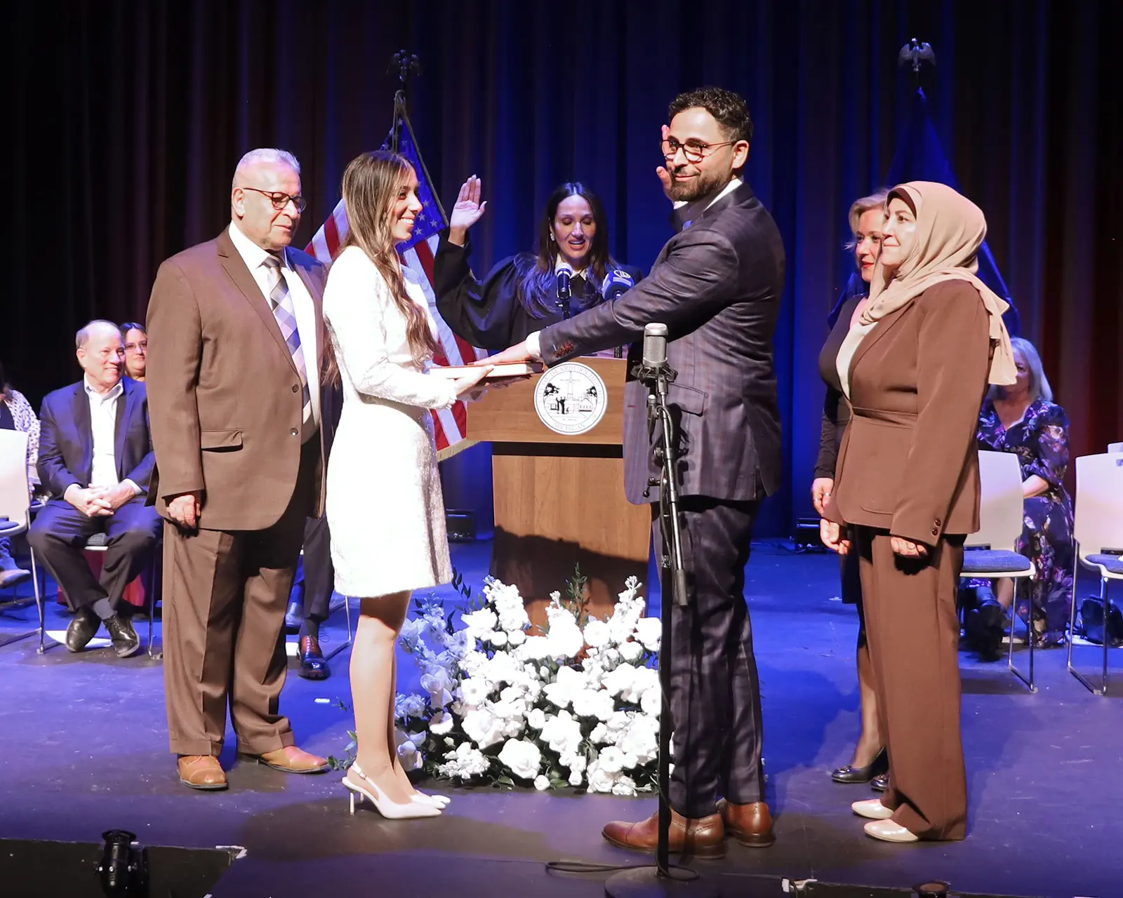 Dearborn Mayor Mo Baydoun taking the oath of office during the official inauguration ceremony held Saturday, January 17 at the Crestwood High School auditorium. – Photo by Abbas Shehab