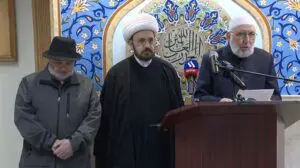 Imam Elturk speaks at the press conference and to his right Imam Elahi and Imad Hamad. – Video grab