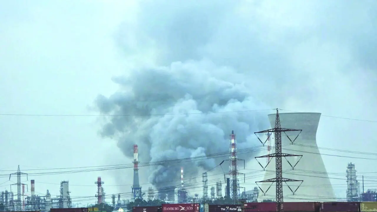 Columns of smoke rise from the oil refinery in Haifa on Thursday.