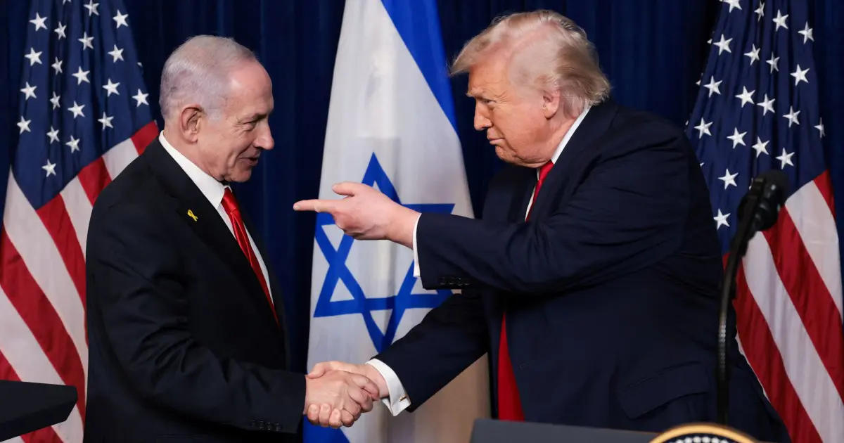 President Donald Trump points his finger towards Israeli Prime Minister Benjamin Netanyahu as they shake hands during a press conference in Palm Beach, Florida, US, December 29, 2025