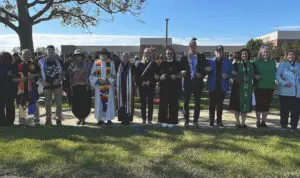 Christian leaders and activists form a human chain around the Muslim prayers in Dearborn at the the Ford Community and Performing Arts Center on Eid al-Adha in a show of support and solidarity, Wednesday, May 27.