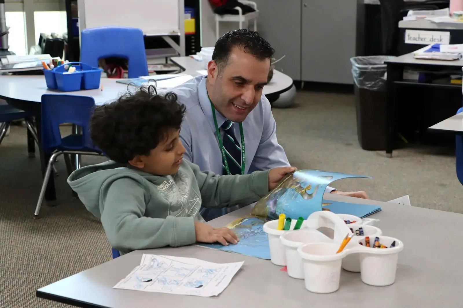 Mike Esseily works with a student in this undated photo. The Dearborn Public Schools Board of Education recently approved a contract hiring Mr. Esseily to be the next superintendent for the district.