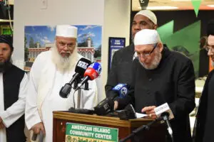 Steve Mustapha Elturk, co-chair of the Imams Council of Michigan, joined by other members of the council, speaks at the American Islamic Community Center in Madison Heights regarding the threats that the mosque faced. July 2. – Video grab