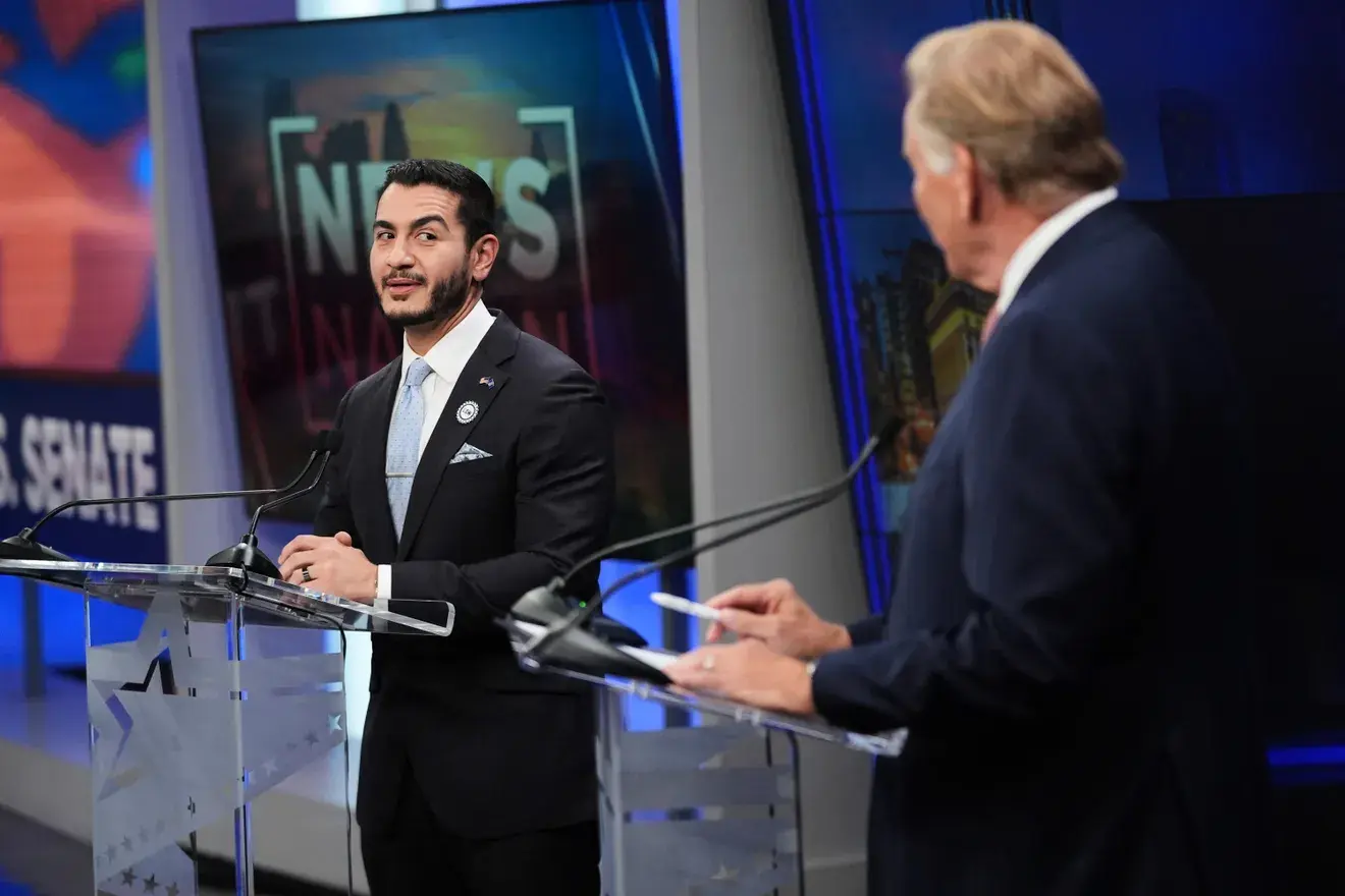 El-Sayed (left) and Rogers during the televised debate in Grand Rapids on Thursday evening, October 8 - Video grab