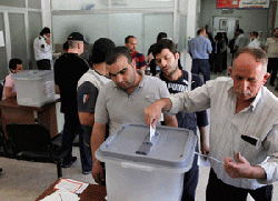 Syria holds elections as bombs rock Damascus