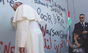 Pope Francis prays at the wall of separation in Bethlehem