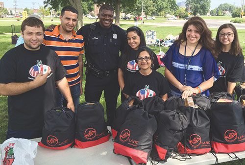 Youth helps needy through LAHC Feeding our Neighbors program