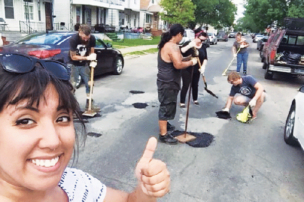 Hamtramck residents work together to repair potholes