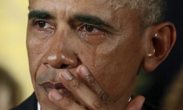 Obama, wiping tears, makes new push to tighten gun rules
